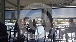 Young people enjoying a drink before sunset at the Helm Bar, Surfers Paradise, Queensland