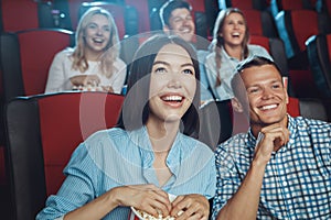 Young people friends together in the cinema