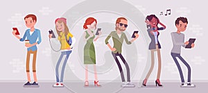 Young people with gadgets standing