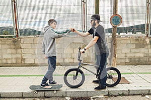 Young people greeting each other on the street. Friends greeting each other