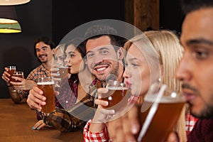 Young People Group In Bar, Friends Sitting At Wooden Counter Pub, Drink Beer