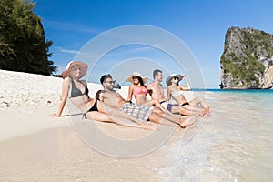 Young People Group On Beach Summer Vacation, Happy Smiling Friends Lying Sand Seaside photo