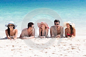 Young People Group On Beach Summer Vacation, Happy Smiling Friends Lying Sand Seaside