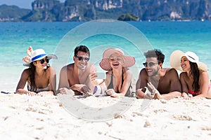 Young People Group On Beach Summer Vacation, Happy Smiling Friends Lying Sand Seaside