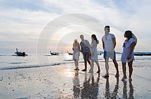 Young People Group On Beach At Sunset Summer Vacation, Friends Walking Seaside