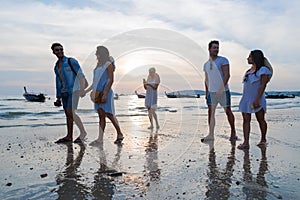 Young People Group On Beach At Sunset Summer Vacation, Friends Walking Seaside