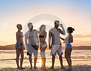 Young People Group On Beach At Sunset Summer Vacation, Happy Smiling Friends Walking Seaside