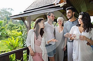 Young People Group On Terrace Tropical Hotel, Friends Tropic Holiday Vacation