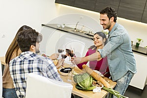 Young people have a meal in the dining room in modern home