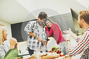 Young people have a meal in the dining room in modern home