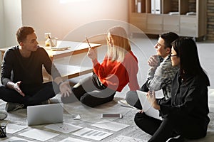 Young people having business meeting indoors