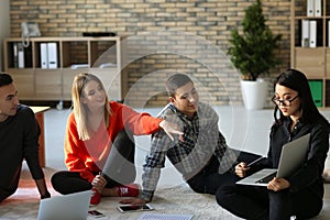 Young people having business meeting indoors