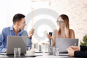 Young people having business meeting in office