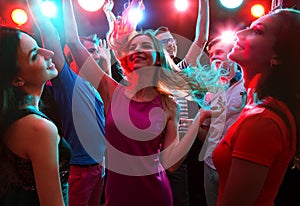 Young people having fun dancing photo