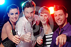 Young people having fun in nightclub photo