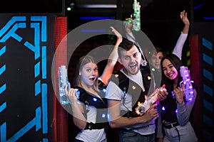 Young people in laser tag labyrinth