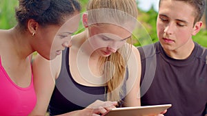 Young people looking on tablet. Close up of worried people looking at tablet