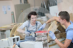 Young people in masonry training