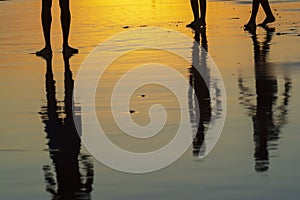 Young people playing sand football at sunset on Ondina beach