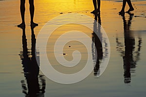 Young people playing sand football at sunset on Ondina beach photo