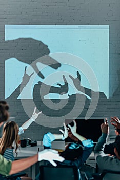 young people playing with shadows after work