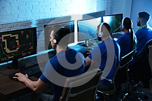 Young people playing video games on computers. Esports tournament photo