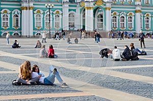 Young people rest on Palace Square, St. Petersburg, Russia