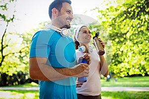 Young people running outdoors. Couple or friends of runners exercising in park