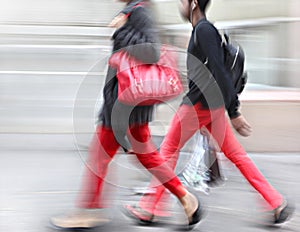 Young people at rush hour walking in the street