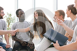young people shaking hands during the Colloquium