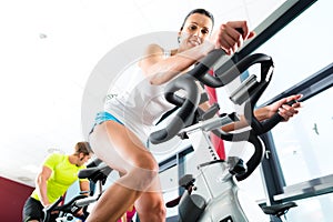 Young People Spinning in the fitness gym