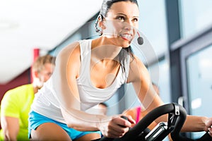 Young People Spinning in the fitness gym