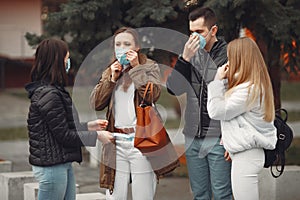 Young people are spreading disposable masks outside photo