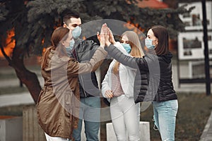 Young people are spreading disposable masks outside photo