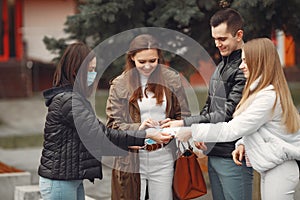 Young people are spreading disposable masks outside photo