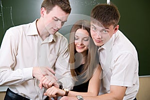 Young people synchronize watches