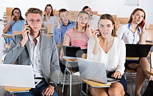 Young people talking on phones