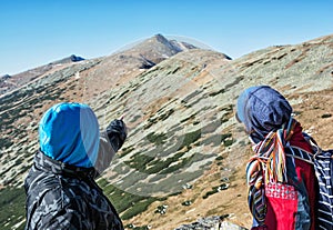 Young people on the trip showing at the hill Chopok, Low Tatras, Slovakia