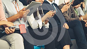 Young people using mobile phone in public underground train