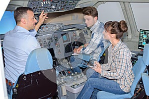 Young people visiting aircraft simulator