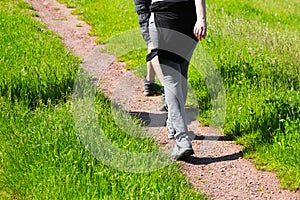 Young people walking along a rural farm track