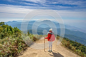 Young people walking on a hilltop in Doi Inthanon, Chiang Mai, Thailand