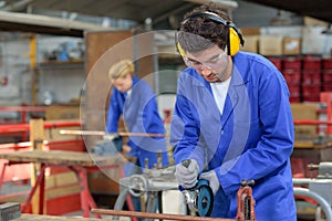 Young people at work in factory