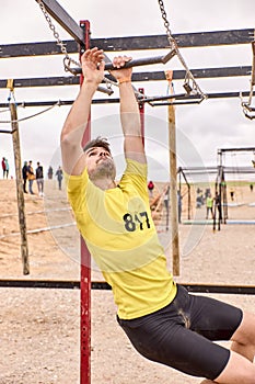 Young person going through an obstacle course in a Spartan race