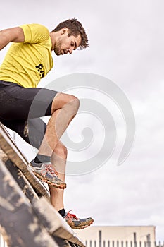 Young person going through an obstacle course in a Spartan race