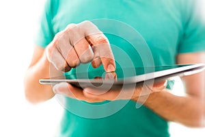 Young person navigating a tablet