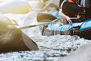 Young person rafting on the river