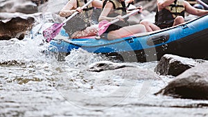 Young person rafting on the river