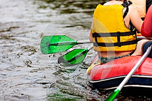 Young person rafting on the river