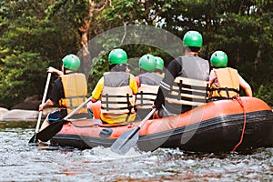 Young person rafting on the river